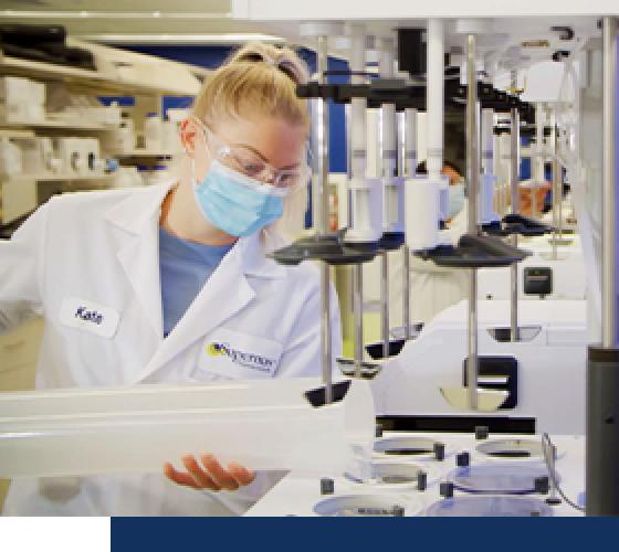 A woman scientist in a lab. 