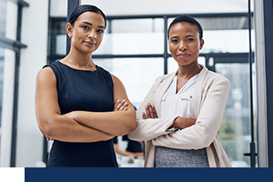 Two women standing.